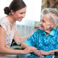 Elderly hospice patient with caregiver